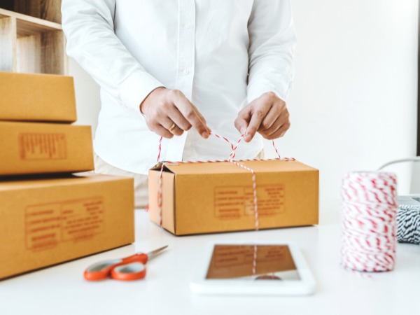 Pharmacist assisting customer at modern pharmacy counter